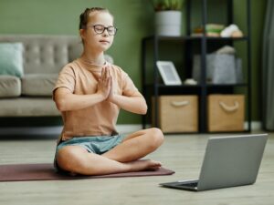 Girl with Down Syndrome in Yoga Class Online