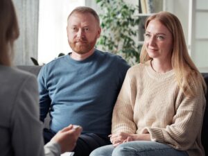 Foster couple having a meeting with social worker