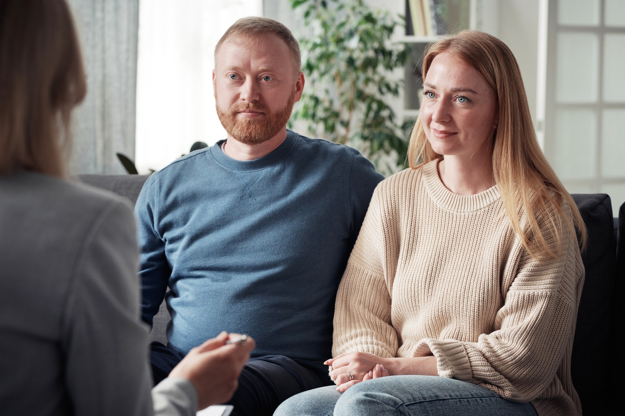 Foster couple having a meeting with social worker