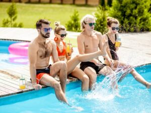 Friends on the swimming pool