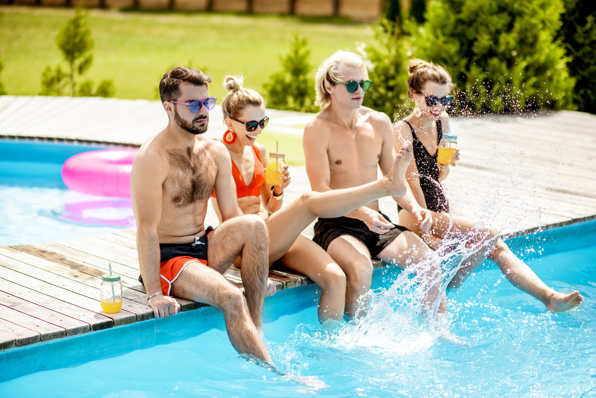 Friends on the swimming pool