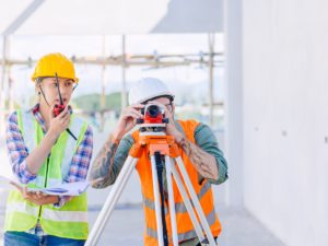 Engineer builder working with Auto Level camera look aim levelling survey construction building