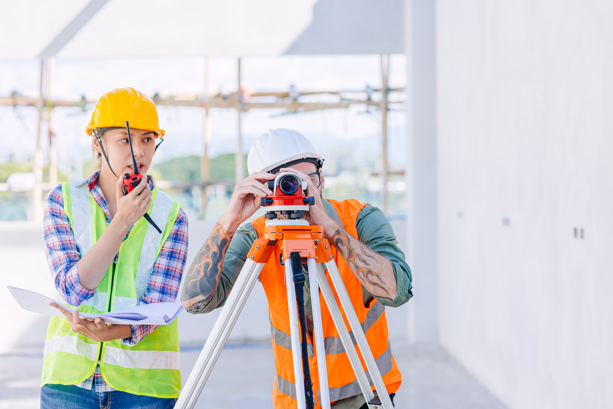 Engineer builder working with Auto Level camera look aim levelling survey construction building